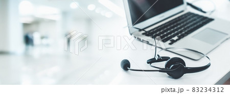 Headset and customer support equipment at call center ready for actively service 83234312