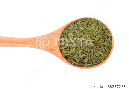 brown rice in wood spoon on white background brown rice in wood spoon on white background 83237223