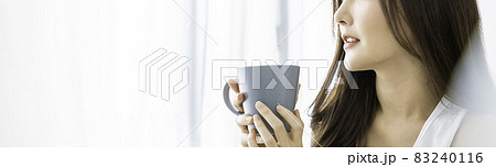 Portrait of young beautiful asian woman hands holding coffee cup morning spring time in white bedroom. Happy cheerful relaxing in summer. Korean makeup wakeup university asia lifestyle concept. 83240116