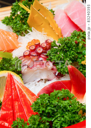 Sashimi (japanese food). Sliced raw seafood in a bowl. Sashimi (japanese food). Sliced raw seafood in a bowl. 83240393