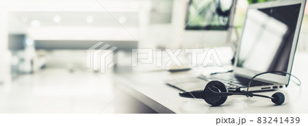 Headset and customer support equipment at call center ready for actively service Headset and customer support equipment at call center ready for actively service 83241439