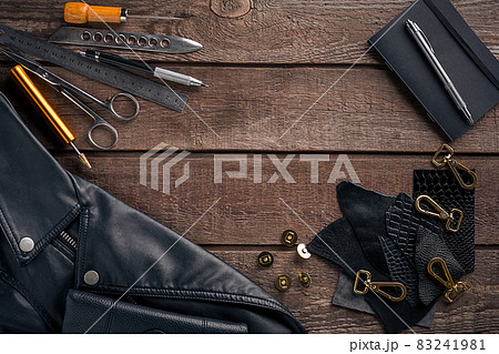 Leather products. Work place craftsman in a workshop. Top view 83241981