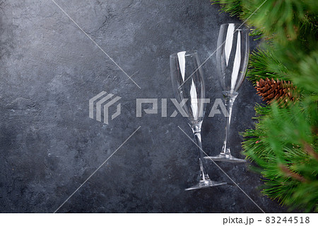 Christmas fir tree and champagne glasses Christmas fir tree and champagne glasses 83244518