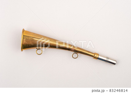 Hunting horn isolated on grey background. Hunting accessory. Hunting horn isolated on grey background. Hunting accessory. 83246814