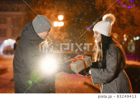 Young couple outdoor in night street at winter time 83249413