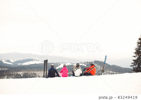 People snowboarding in the mountains with the snowboard People snowboarding in the mountains with the snowboard 83249419