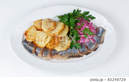 Image of pickled herring with potato and onion, top view 83249729