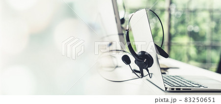 Headset and customer support equipment at call center ready for actively service 83250651