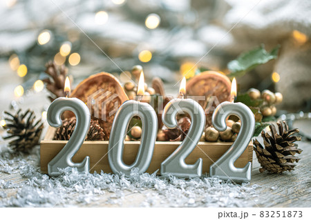 Festive New Year background with candles in the form of the numbers 2022. Festive New Year background with candles in the form of the numbers 2022. 83251873