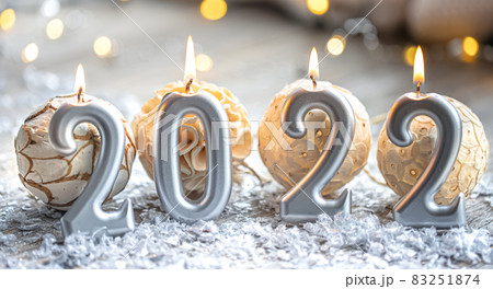 Festive New Year background with candles in the form of the numbers 2022. Festive New Year background with candles in the form of the numbers 2022. 83251874
