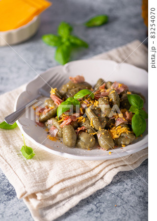 Spinach gnocchi with ham Spinach gnocchi with ham 83254070