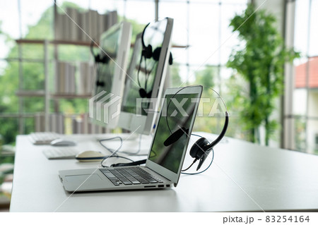 Headset and customer support equipment at call center ready for actively service 83254164
