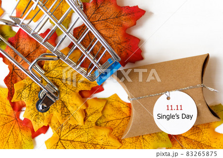 Single's day sale concept of China, 11.11. The gift box and shopping cart and text 11.11 single's day sale with white backgroung 83265875