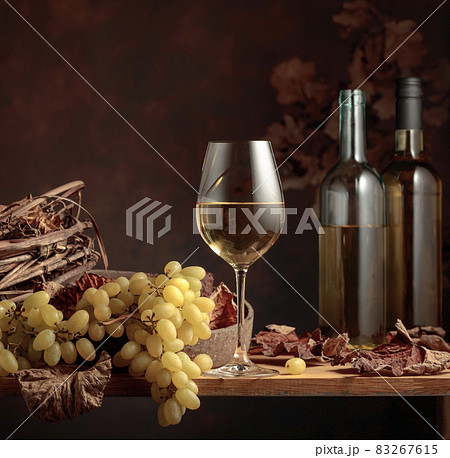 White wine and bunch of grapes. White wine and bunch of grapes. 83267615