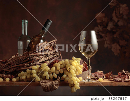 White wine and bunch of grapes. White wine and bunch of grapes. 83267617