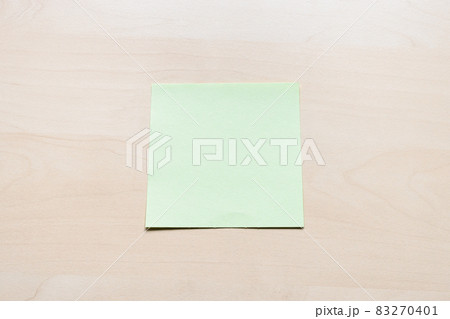 blank green sheet of note paper on light board blank green sheet of note paper on light board 83270401