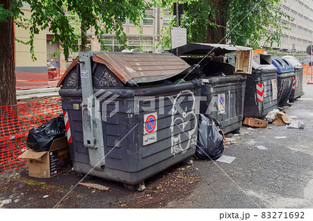 Rome, Italy many big garbage bins with trash outside. 83271692