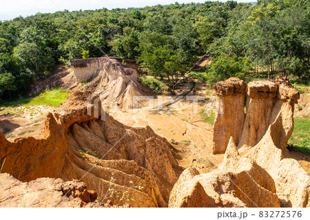 Within a national park named Phae Mueang Phi caused by the terrain which is the soil and sandstone was naturally eroded into various shapes that are In Phrae Province of Thailand. Within a national park named Phae Mueang Phi caused by the terrain which is the soil and sandstone was naturally eroded into various shapes that are In Phrae Province of Thailand. 83272576