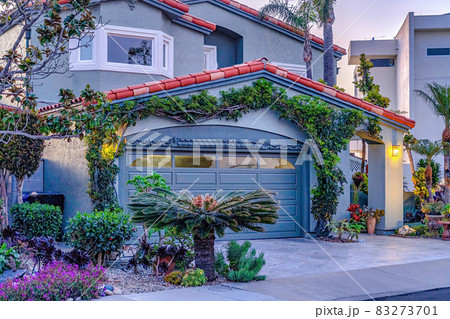 facade of gray house with bay window gable roof over garage and arched entrance facade of gray house with bay window gable roof over garage and arched entrance 83273701