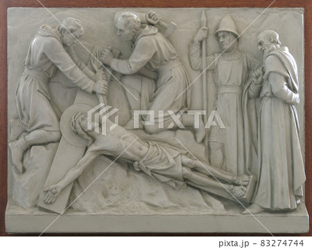 11th Station of the Cross - Crucifixion: Jesus is nailed to the cross 11th Station of the Cross - Crucifixion: Jesus is nailed to the cross 83274744