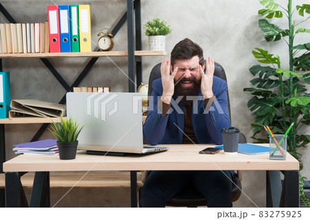 Hysterical weeping. Hysterical businessman weep in office 83275925