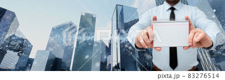 Businessman Holding Empty Page Graphing Notebook With His Both Hands Around Futuristic Technology. Employee Presenting Blank Workbook Surrounded By Modern Automation. Businessman Holding Empty Page Graphing Notebook With His Both Hands Around Futuristic Technology. Employee Presenting Blank Workbook Surrounded By Modern Automation. 83276514