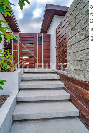 Stairs against wooden gate and door at house entrance in San Diego California Stairs against wooden gate and door at house entrance in San Diego California 83276532