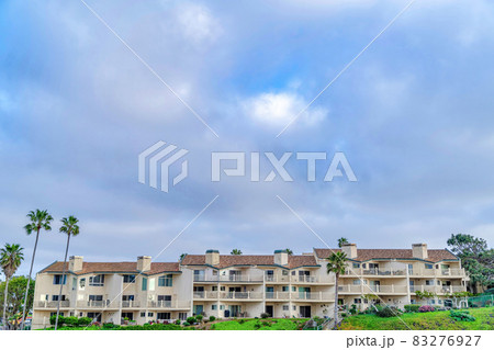 Residential houses with clouds and blue sky background in San Diego California Residential houses with clouds and blue sky background in San Diego California 83276927