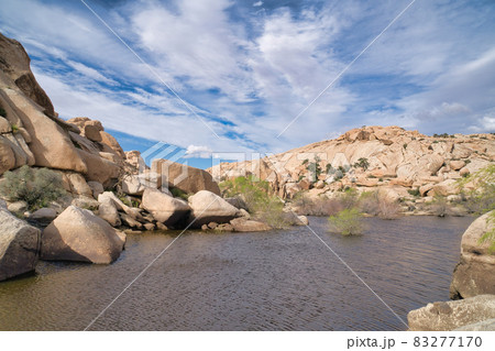 View of stream on a hiking nature trail at Joshua Tree National Park California 83277170