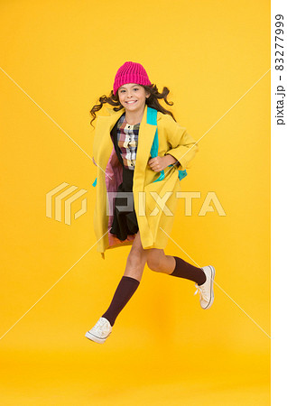 Cool schoolgirl. Have fun charismatic girl on yellow background. Cool schoolgirl. Have fun charismatic girl on yellow background. 83277999