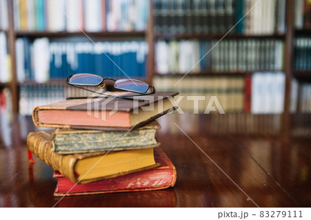 glasses old books library. High quality and resolution beautiful photo concept glasses old books library. High quality and resolution beautiful photo concept 83279111