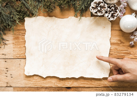 hand near paper christmas decorations. High quality and resolution beautiful photo concept hand near paper christmas decorations. High quality and resolution beautiful photo concept 83279134