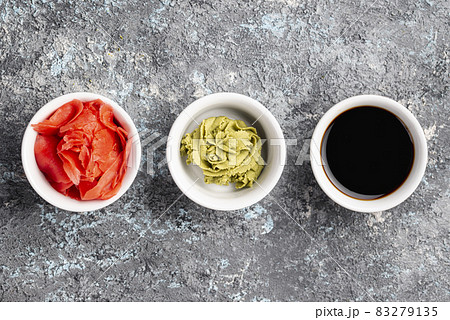 flat lay ginger wasabi soy sauce bowls. High quality and resolution beautiful photo concept flat lay ginger wasabi soy sauce bowls. High quality and resolution beautiful photo concept 83279135