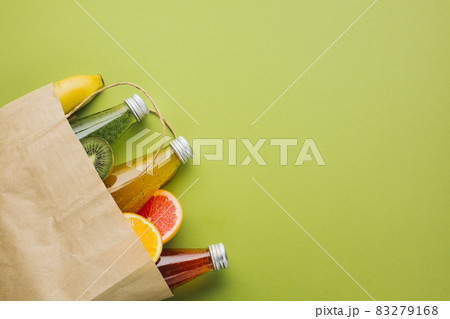 flatlay paper bag with fruit juices. High quality and resolution beautiful photo concept 83279168