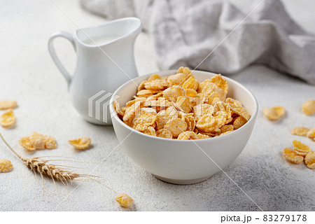 high angle breakfast corn flakes bowl with milk wheat. High quality and resolution beautiful photo concept 83279178