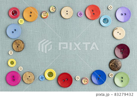 flat lay colorful buttons on cloth. High quality and resolution beautiful photo concept flat lay colorful buttons on cloth. High quality and resolution beautiful photo concept 83279432