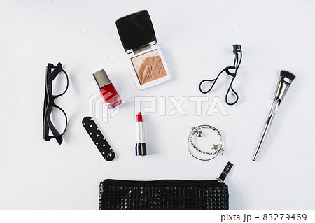 glasses cosmetics near stylish makeup bag. High quality and resolution beautiful photo concept glasses cosmetics near stylish makeup bag. High quality and resolution beautiful photo concept 83279469