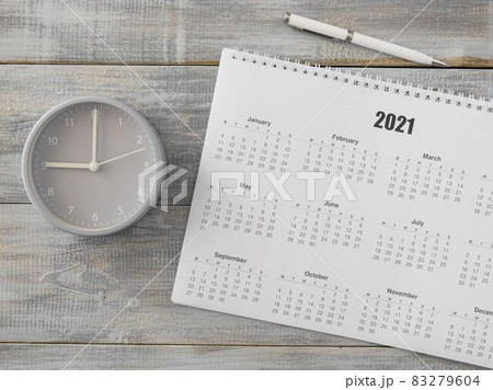 flat lay desk calendar and analog clock. High quality and resolution beautiful photo concept flat lay desk calendar and analog clock. High quality and resolution beautiful photo concept 83279604