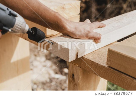 high view person holding hammer drill. High quality and resolution beautiful photo concept 83279677