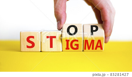 Stop stigma symbol. Doctor turns wooden cubes with words stop stigma. Beautiful yellow table, white background. Medical and stop stigma concept. Copy space. 83281427