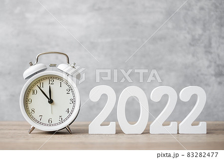 Happy New Year with vintage alarm clock and 2022 number. Christmas, New Start, Resolution, countdown, Goals, Plan, Action and Motivation Concept 83282477