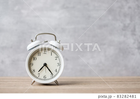 Vintage alarm clock on wooden table background and copy space for text. Activity, daily routine, morning, countdown, workout and Work life balance concept 83282481