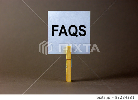 FAQS, frequently asked questions symbol. White paper on wooden clothespin. Words 'FAQS, frequently asked questions'. Beautiful grey background. Business and FAQS concept, copy space. FAQS, frequently asked questions symbol. White paper on wooden clothespin. Words 'FAQS, frequently asked questions'. Beautiful grey background. Business and FAQS concept, copy space. 83284331