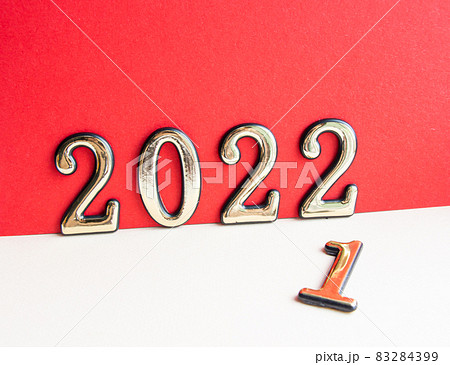 festive and numbers 2022 on red background new year festive and numbers 2022 on red background new year 83284399