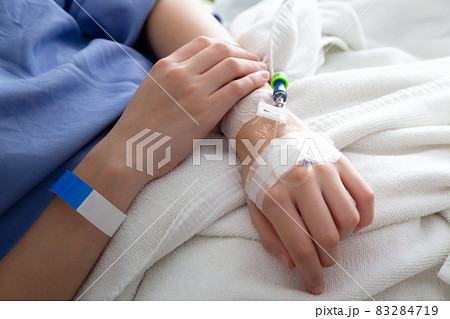 female patient sleeping on the patient bed in the room after surgery at the hospital. female patient sleeping on the patient bed in the room after surgery at the hospital. 83284719