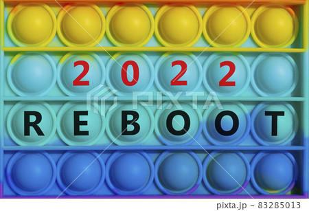 Reboot planning 2022 new year symbol. Words 'Reboot 2022' on rainbow Pop It. Beautiful background, copy space. Business and Reboot 2022 new year concept. Reboot planning 2022 new year symbol. Words 'Reboot 2022' on rainbow Pop It. Beautiful background, copy space. Business and Reboot 2022 new year concept. 83285013