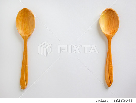 Two beautiful wooden spoons isolated on white background. 83285043
