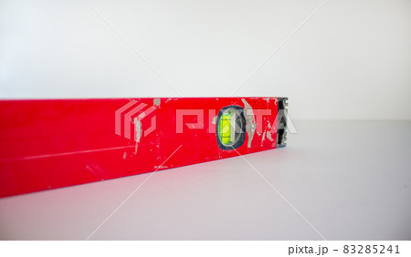 Building tool level. Red water level tool isolated on white background. Concept. Copy space. 83285241