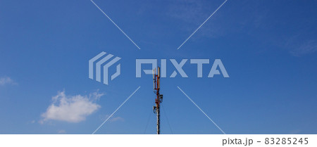 Mobile communications tower on a background of blue sky. Copy space. Concept. 83285245