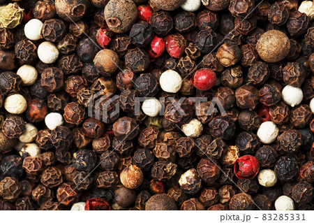 A mixture of peppercorns as a textural background in full screen. A mixture of peppercorns as a textural background in full screen. 83285331